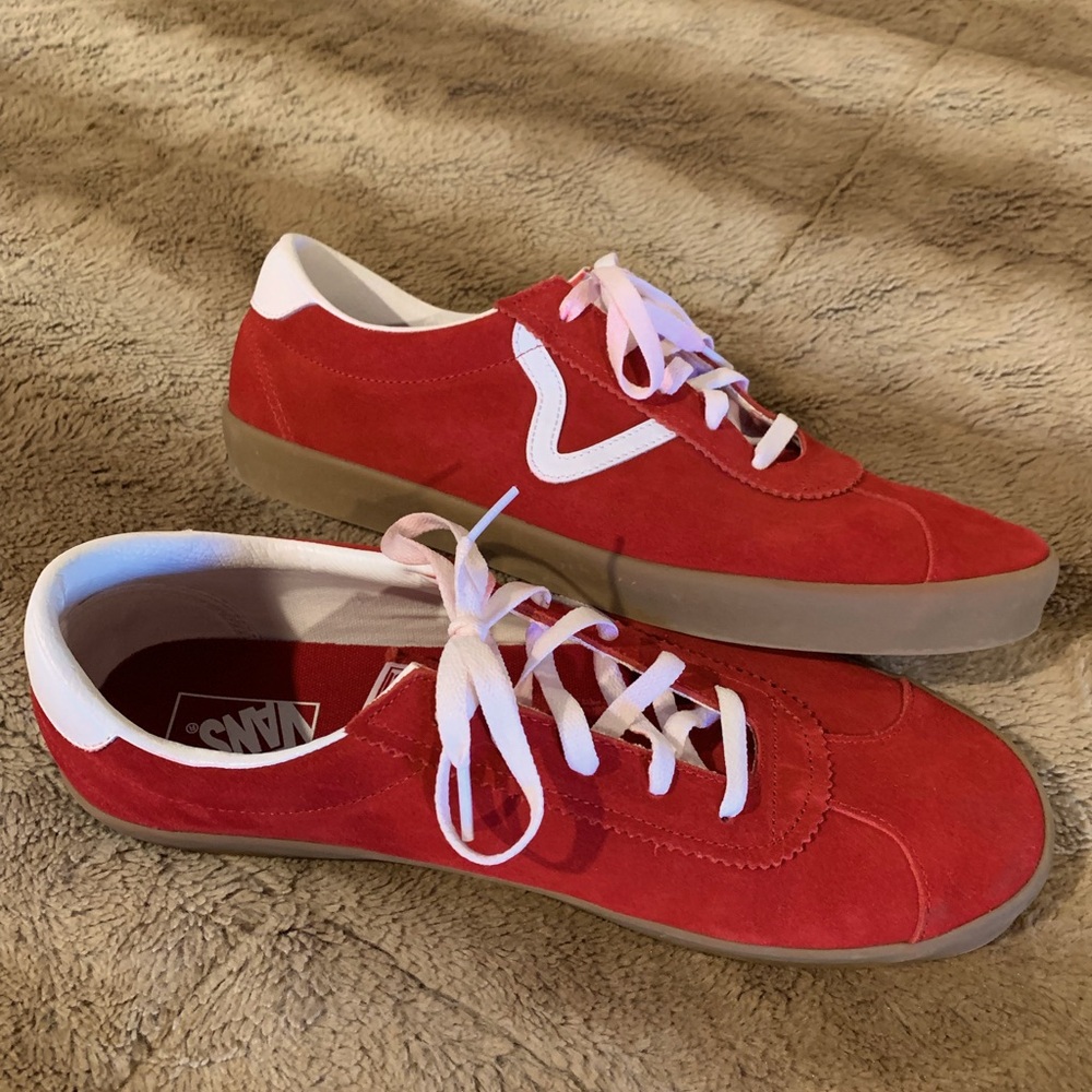 Men’s size 13, low top, red suede Vans.